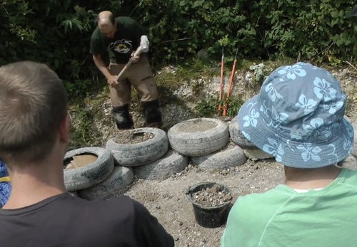 Earth tyre brick wall workshop