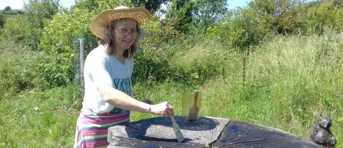 Oiling the furniture at Racehill orchard